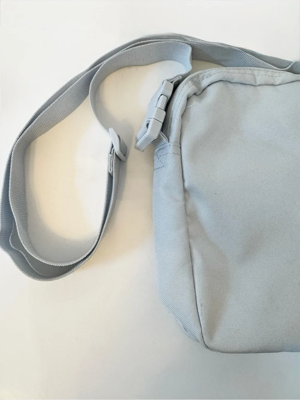 Nike Small Light Blue Crossbody Bag with Purple Logo